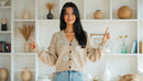 Smiling Woman in Cozy Beige Cardigan in Minimalist Home