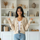 Smiling Woman in Cozy Beige Cardigan at Home