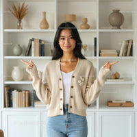 Smiling Woman in Cozy Beige Cardigan at Home