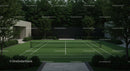 Modern Tennis Court Surrounded by Lush Greenery