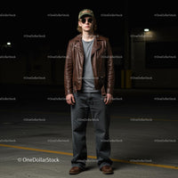 Stylish Young Man in Brown Leather Jacket and Sunglasses