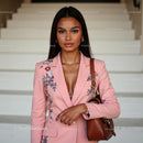 Elegant Woman in a Floral Pink Blazer