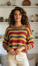 Smiling Woman in Colorful Striped Sweater at Home