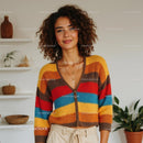 Smiling Woman in Cozy Beige Cardigan at Home