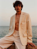 Stylish Man in Beige Suit by the Ocean at Sunset
