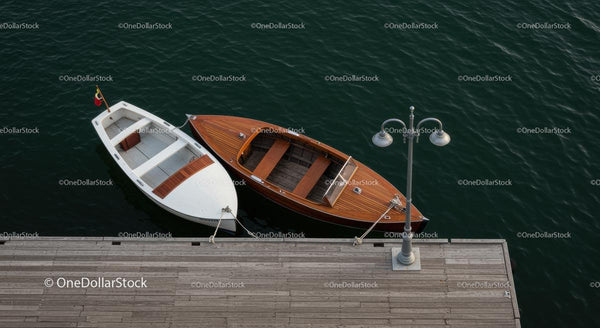 Wooden and White Boats Docked at Tranquil Pier