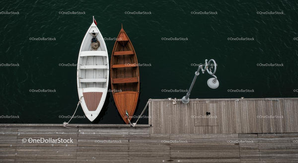Two Rowing Boats Moored at a Wooden Pier