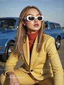 Stylish Woman in Yellow Suit with Vintage Blue Car