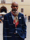 Confident Man in Dark Suit with Stylish Scarf