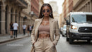 Stylish Woman in Beige Suit Walking Down City Street