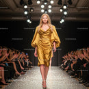 Model in Golden Gown on Fashion Show Runway