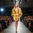 Runway Model in Glamorous Golden Dress on Catwalk