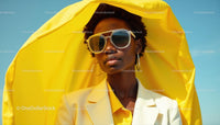 Stylish Woman in Yellow Attire Under Sunlit Sky
