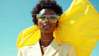 Elegant Woman in Yellow with Sunglasses on a Sunny Day