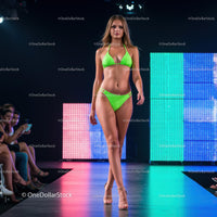 Glamorous Runway Model in Green Bikini at Fashion Show