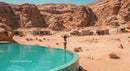 Woman Relaxing by Infinity Pool in Desert Resort