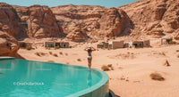 Woman Relaxing by Infinity Pool in Desert Resort