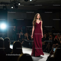 Model in Elegant Burgundy Evening Gown on Runway