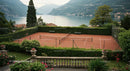 Luxury Outdoor Tennis Court Surrounded by Lush Greenery