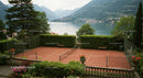 Scenic Tennis Court Overlooking Tranquil Lake and Mountains