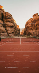 Red Clay Tennis Court Amidst Majestic Desert Cliffs