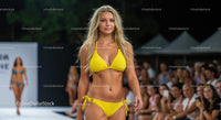 Model in Yellow Bikini Stepping the Runway at Fashion Show