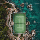 Tennis Court by Turquoise Sea with Rocky Coastline