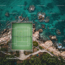 Scenic Aerial Shot of Tennis Court by Rocky Coastline