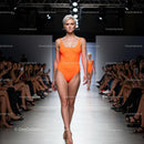 Model in Orange Swimsuit Walking Fashion Show Runway