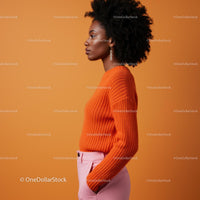Elegant Woman in Orange Sweater and Pink Trousers