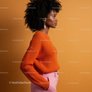 Stylish Woman in Orange Sweater and Pink Pants Side Profile