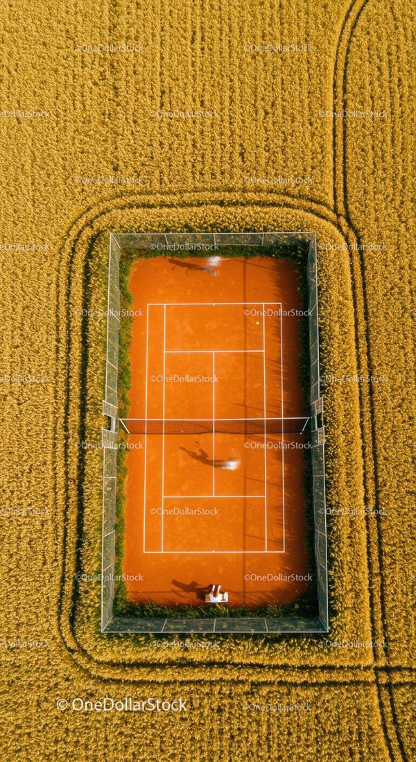 Aerial View of Tennis Court in Wheat Field