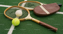 Vintage Tennis Racket and Balls on Green Grass Court
