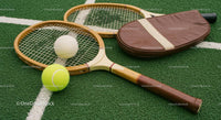Vintage Tennis Racket and Balls on Green Grass Court