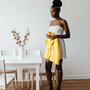 Stylish Woman in Modern Dining Room with Yellow Jacket