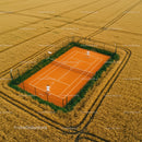 Aerial View of Tennis Court in Golden Wheat Field