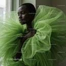 Elegant Woman in Green Tulle Couture Gown