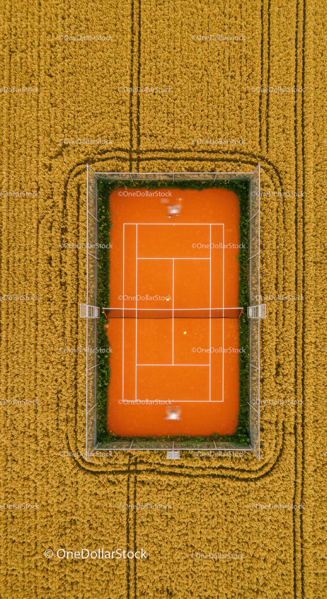 Aerial View of Tennis Court Amidst Golden Wheat Field