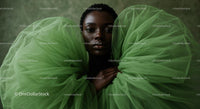 Elegant Woman in Green Tulle Dress with Minimalist Background