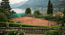 Tennis Court by Scenic Lake and Mountains