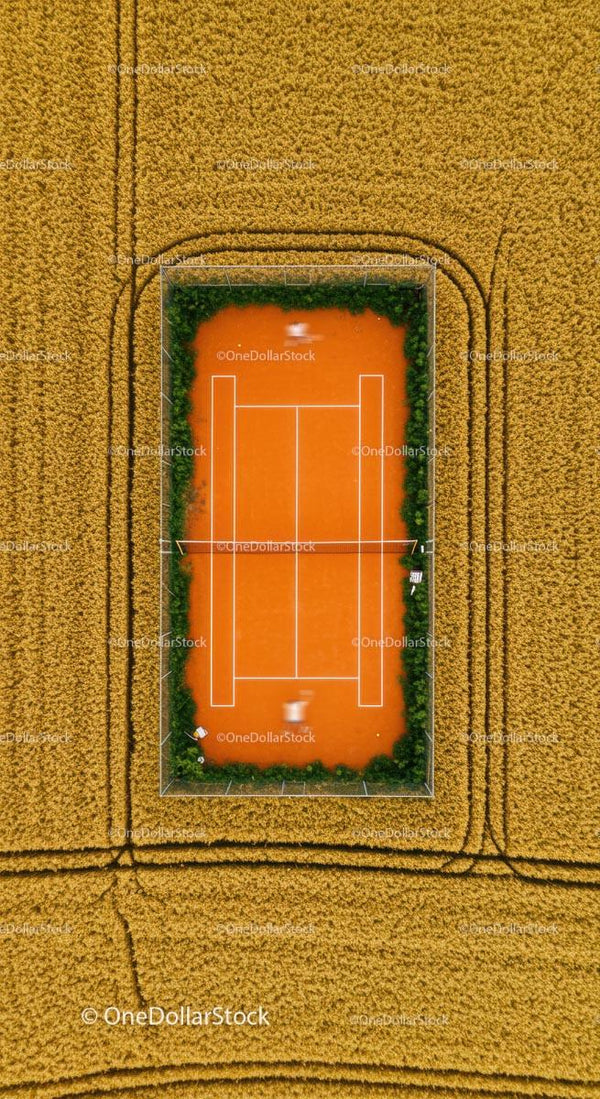 Aerial View of Tennis Court Amidst Golden Wheat Fields