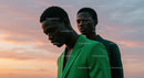 Stylish Young Men in Green and Denim at Sunset