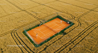 Aerial View of Tennis Court in Golden Wheat Field