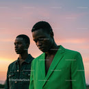 Fashionable Duo in Vibrant Green and Denim at Sunset