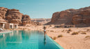 Infinity Pool in Desert Oasis with Sandstone Cliffs