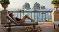 Woman Sunbathing on Patio with Stunning Sea View