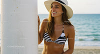 Smiling Woman in Sun Hat Enjoying Sunny Beach