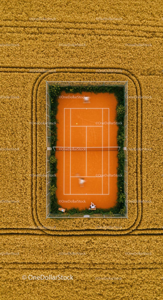 Aerial View of Tennis Court in Wheat Field