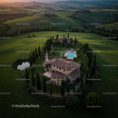 Aerial View of a Tuscan Villa Amid Rolling Hills at Sunset