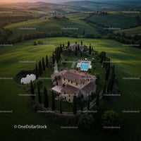 Aerial View of a Tuscan Villa Amid Rolling Hills at Sunset